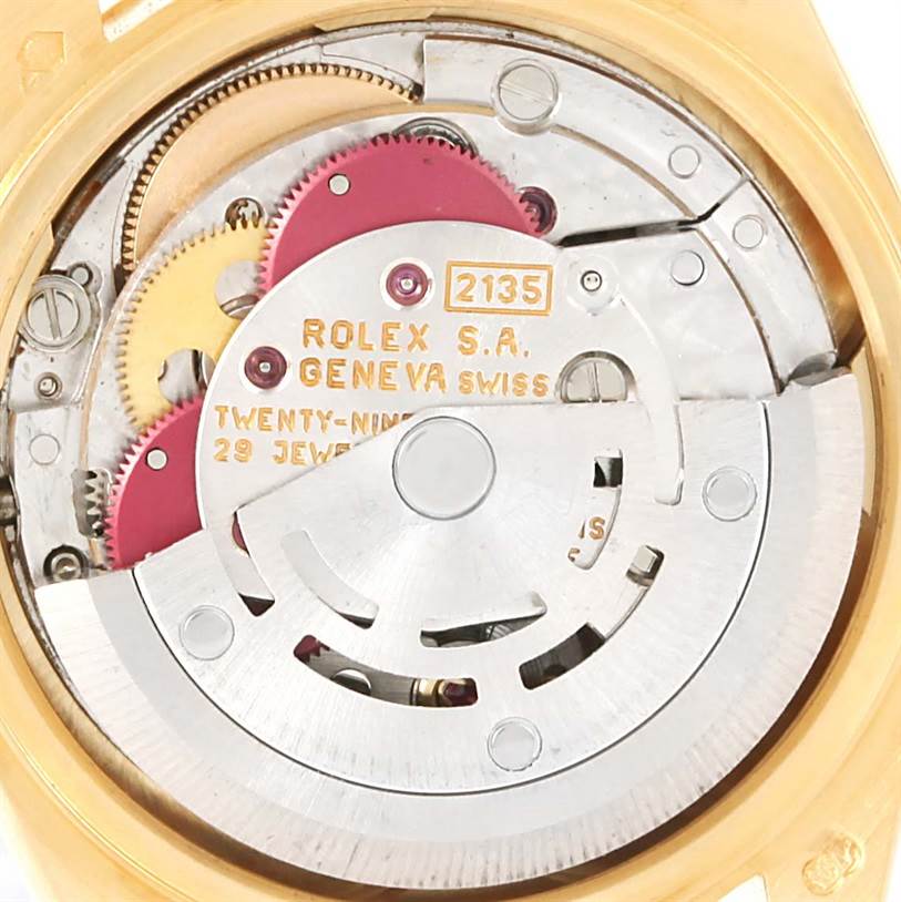 The image shows the intricate internal movement parts of a Rolex President 69178 Women's Yellow Gold White Dial 69178 Women's Yellow Gold White Dial model watch, viewed from the back case.