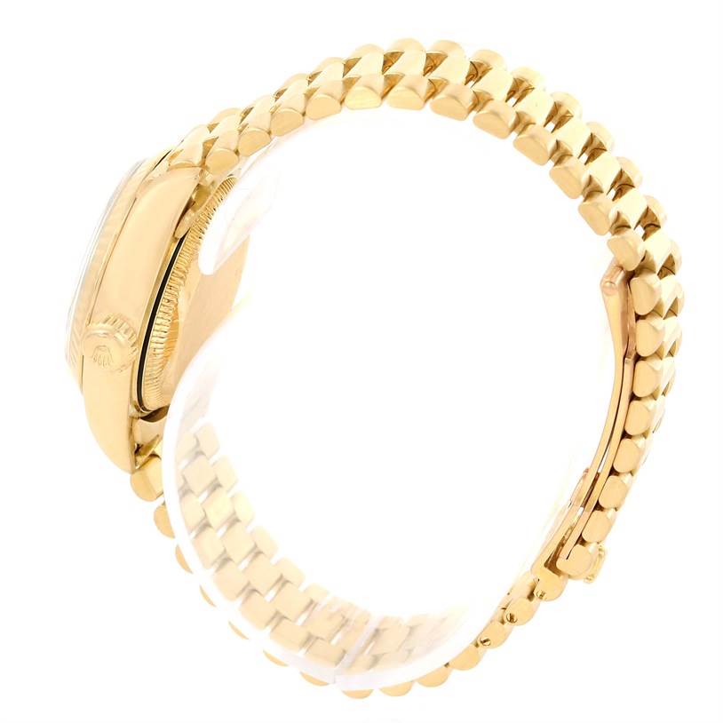 This image shows a side view of a Rolex President 69178 Women's Yellow Gold White Dial 69178 Women's Yellow Gold White Dial watch, focusing on the gold watch case, crown, and bracelet.