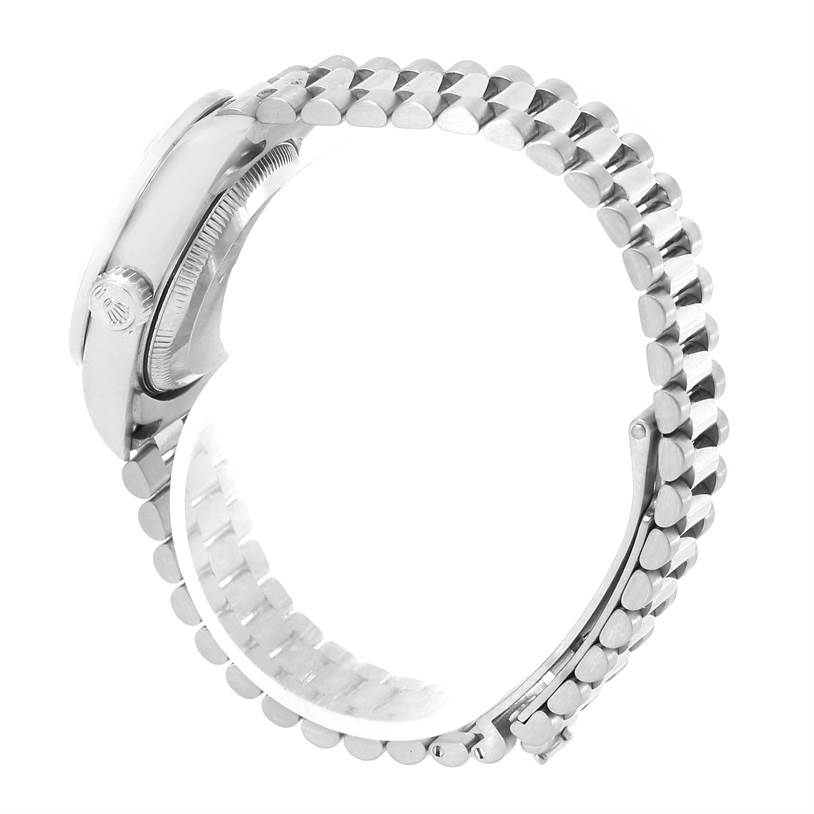 This Rolex President 79179 Women's White Gold Silver Dial 79179 Women's White Gold Silver Dial model watch is shown from a side angle, highlighting its case, crown, and linked bracelet.