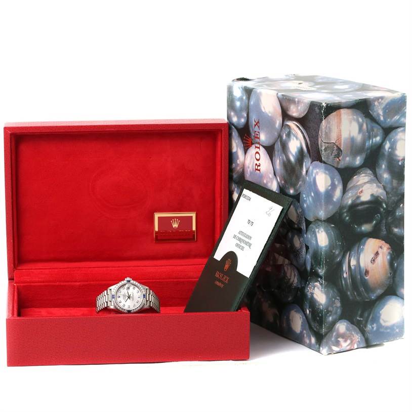 The image shows a Rolex President 79179 Women's White Gold Silver Dial 79179 Women's White Gold Silver Dial model watch inside a red box, with its certificate and outer packaging visible.