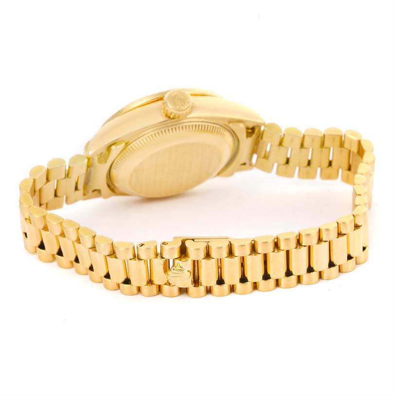 This image shows the back and bracelet of a Rolex President 69168 Women's Yellow Gold Champagne Dial 69168 Women's Yellow Gold Champagne Dial model watch, viewed from a slightly side angle.