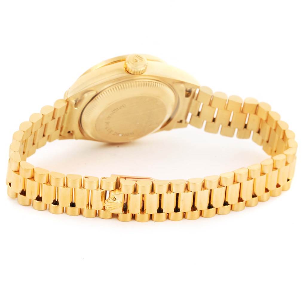 The image shows the back of a Rolex President 69158 Men
s Yellow Gold Champagne Dial 69158 Men
s Yellow Gold Champagne Dial model watch, including the case back, crown, and gold bracelet.