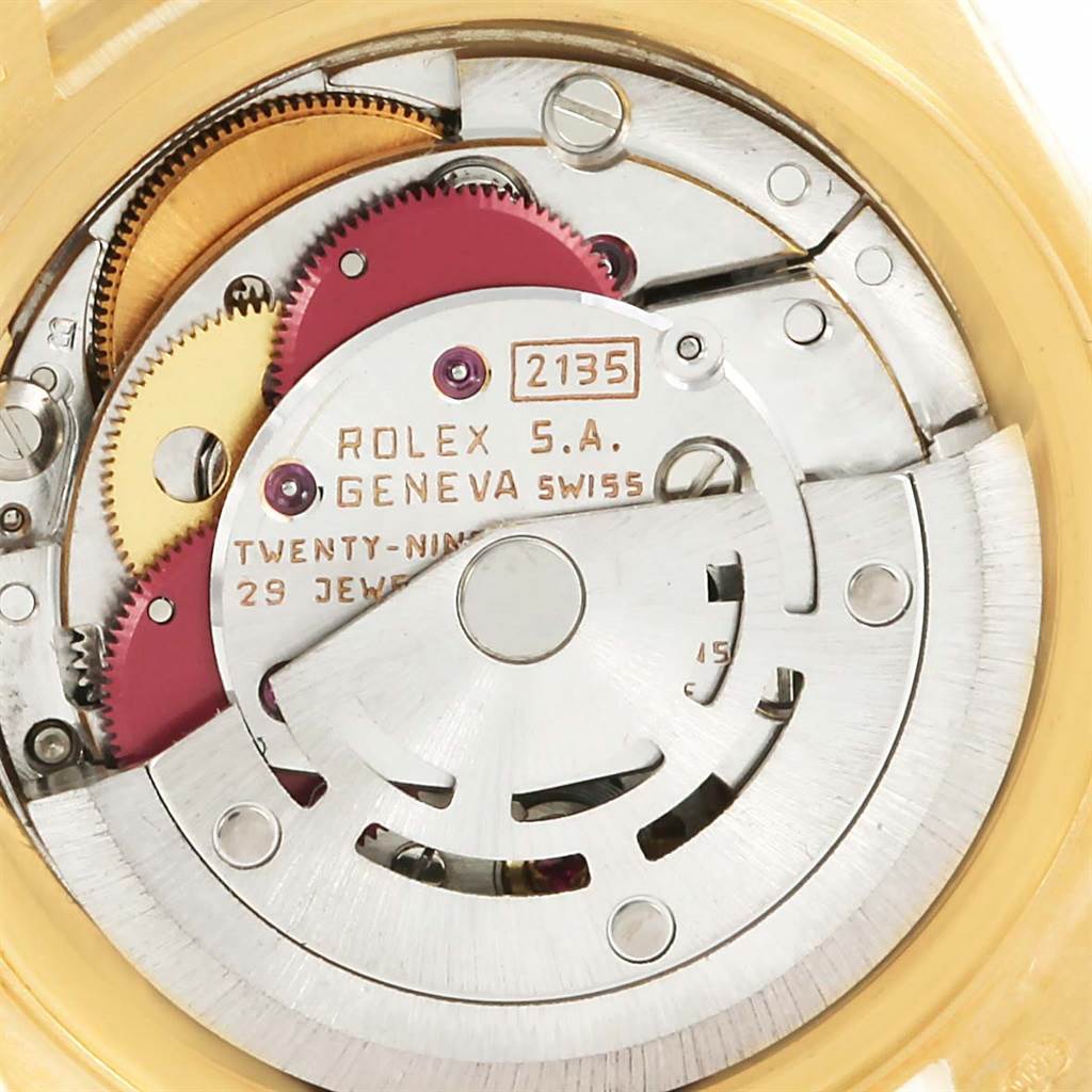 This image shows the internal mechanism of a Rolex President 69158 Men
s Yellow Gold Champagne Dial 69158 Men
s Yellow Gold Champagne Dial model watch, highlighting gears and the movement.