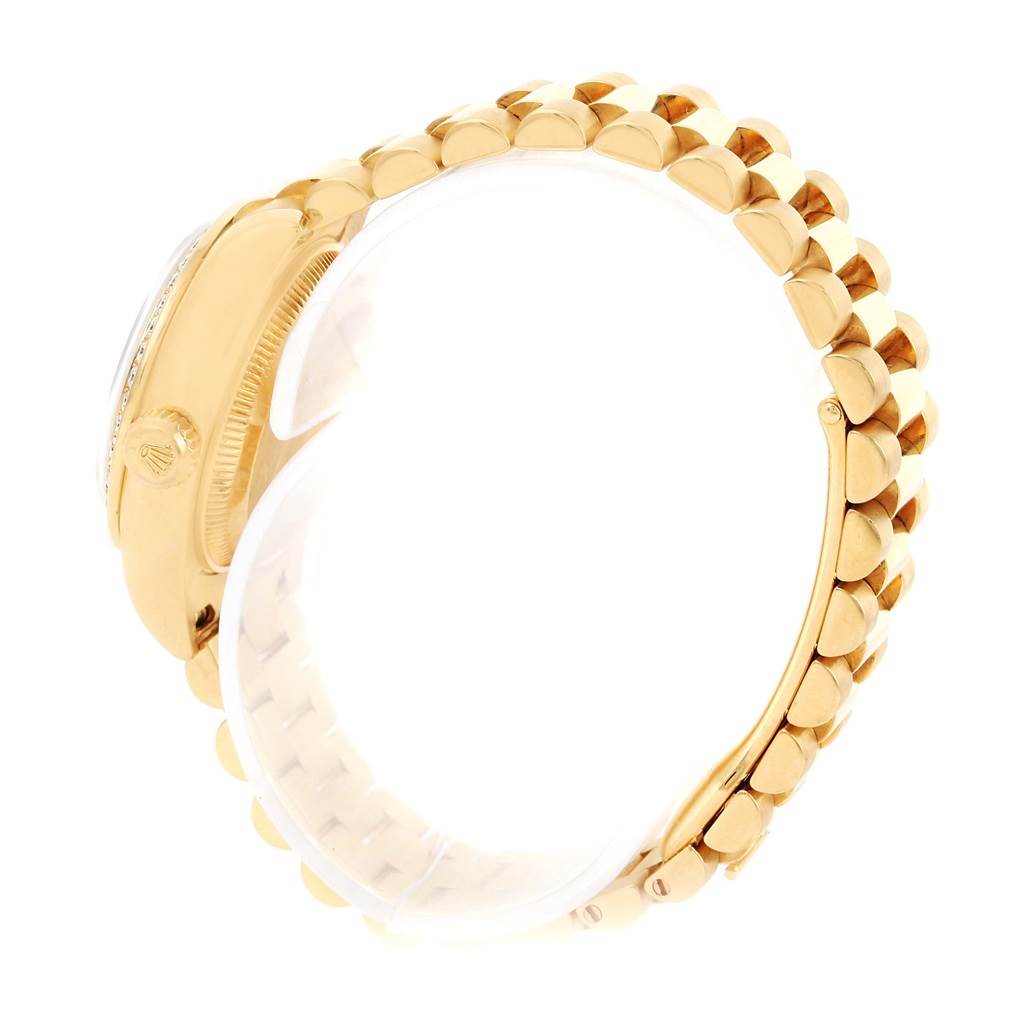 The image shows a side view of a Rolex President 179138 Women's Yellow Gold Mother of Pearl Dial 179138 Women's Yellow Gold Mother of Pearl Dial model wristwatch, highlighting its gold case and bracelet.