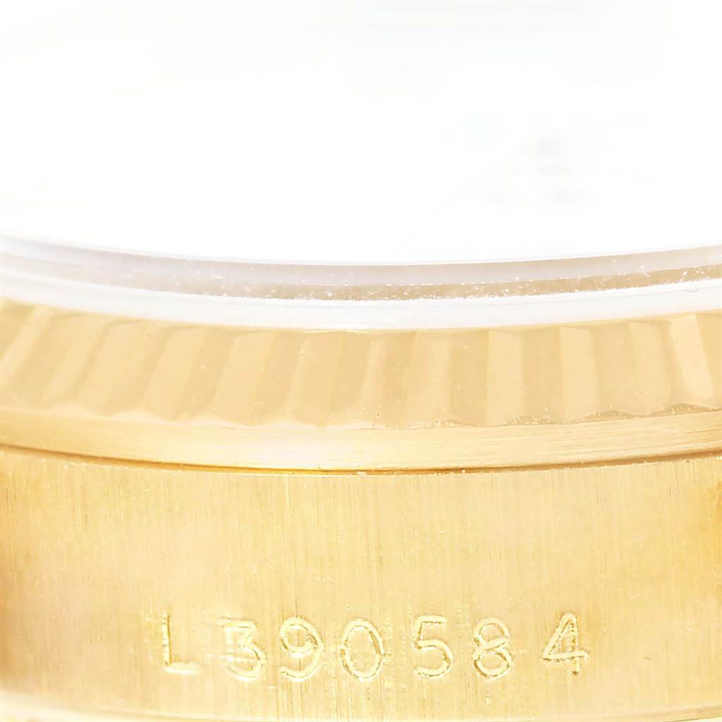 The image shows a close-up of the serial number engraved on the gold case of a Rolex President 68278 Women's Yellow Gold White Dial 68278 Women's Yellow Gold White Dial model watch.