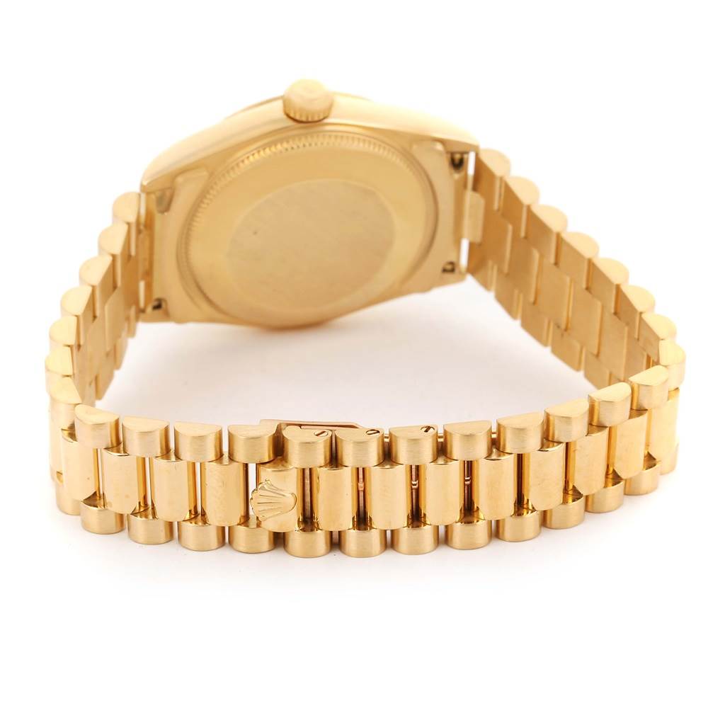 The image shows the back view of a Rolex President 68278 Women's Yellow Gold White Dial 68278 Women's Yellow Gold White Dial model watch, highlighting its gold bracelet and clasp.