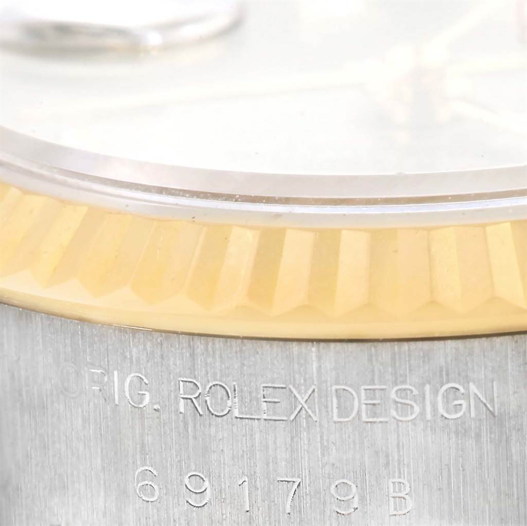 This close-up angle shows the side details, including the bezel and engraving on the case, of the Rolex President 69179 Women's White Gold Silver Dial 69179 Women's White Gold Silver Dial model watch.