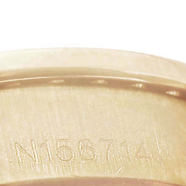 This image shows a close-up angle of the band or inner clasp of a Rolex President 69238 Women
s Yellow Gold Black Dial 69238 Women
s Yellow Gold Black Dial model watch, featuring a visible serial number.