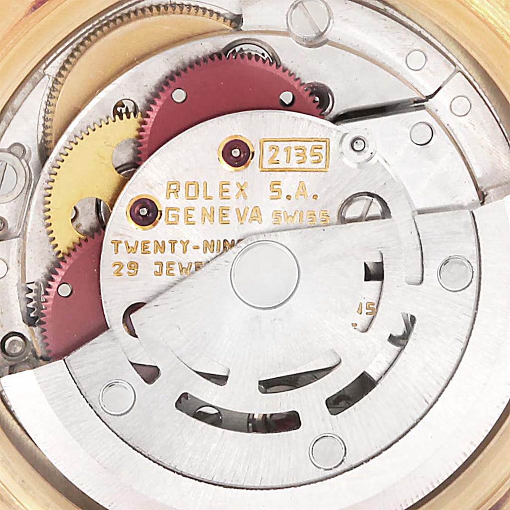 This image shows a close-up view of the movement mechanism of a Rolex President 69238 Women
s Yellow Gold Black Dial 69238 Women
s Yellow Gold Black Dial model watch.