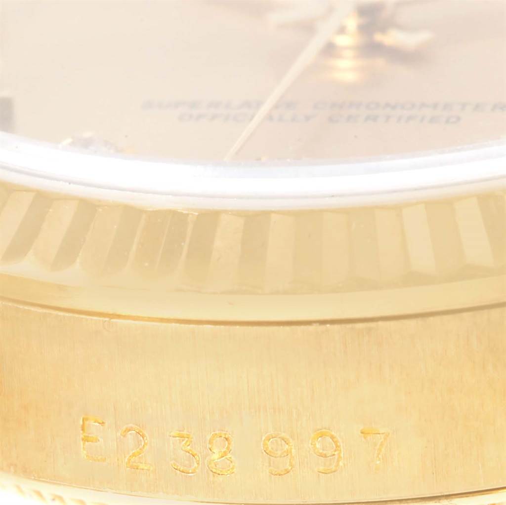 This is a close-up angle showing the bezel, dial edge, and serial number on the case of a Rolex President 68278 Women's Yellow Gold Champagne Dial 68278 Women's Yellow Gold Champagne Dial model watch.