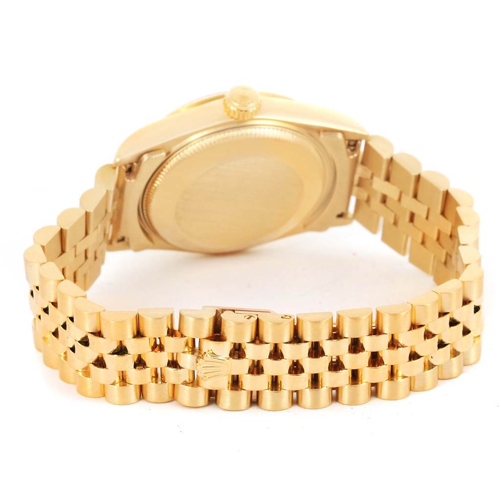 The image shows the back case and bracelet of a Rolex President 68278 Women's Yellow Gold Blue Dial 68278 Women's Yellow Gold Blue Dial model watch at an angled view.