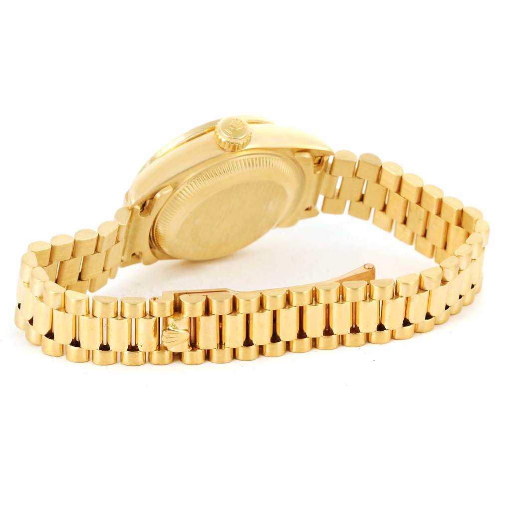 The image shows the back and bracelet of the Rolex President 69138 Women's Yellow Gold Champagne Dial 69138 Women's Yellow Gold Champagne Dial model, focusing on the clasp and crown.