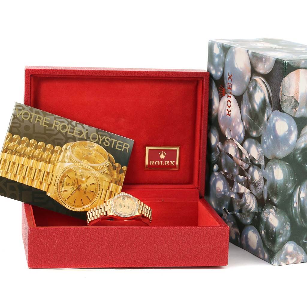 This image shows the Rolex President 69138 Women's Yellow Gold Champagne Dial 69138 Women's Yellow Gold Champagne Dial model watch at a front angle, along with its box, manual, and outer packaging.