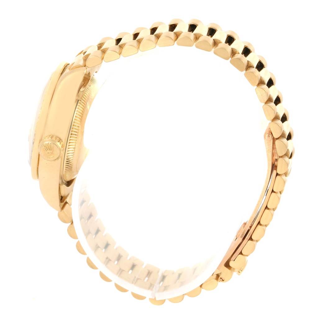 The image shows a side view of the Rolex President 69138 Women's Yellow Gold Champagne Dial 69138 Women's Yellow Gold Champagne Dial model watch, highlighting the case, crown, and part of the bracelet.