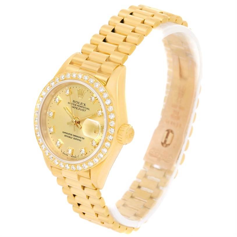 This image shows a gold Rolex President 69138 Women's Yellow Gold Champagne Dial 69138 Women's Yellow Gold Champagne Dial model watch at an angle highlighting the face, bezel, and bracelet.