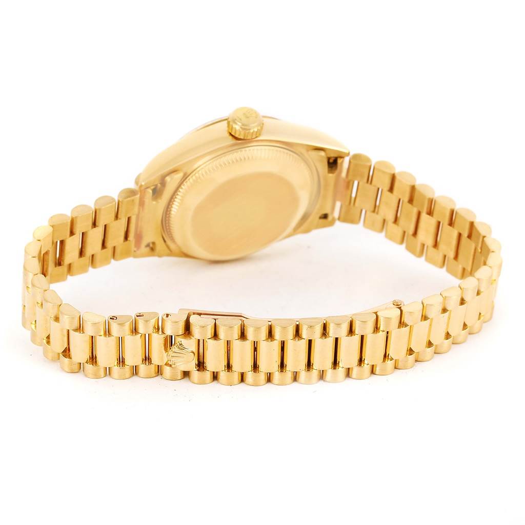 The image shows the back view of a Rolex President 69178 Women's Yellow Gold Champagne Dial 69178 Women's Yellow Gold Champagne Dial model watch, highlighting its gold case and bracelet.