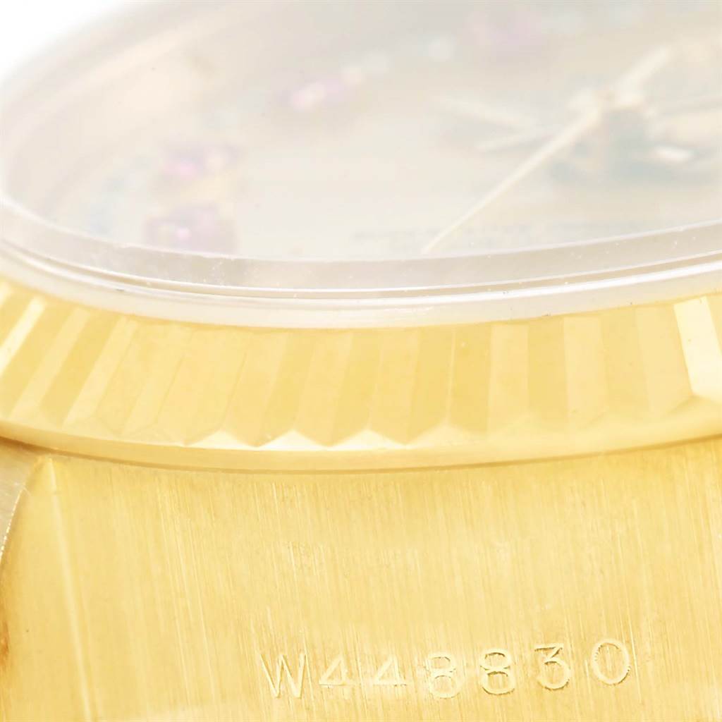 This image shows a close-up of the bezel and part of the case of a Rolex President 69178 Women's Yellow Gold Champagne Dial 69178 Women's Yellow Gold Champagne Dial model watch.