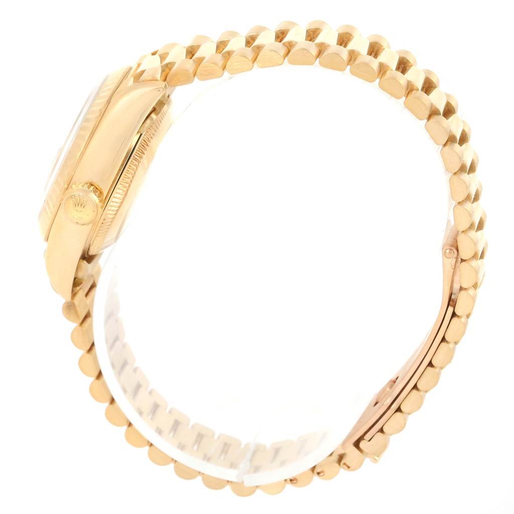 The image shows a side view of a Rolex President 69178 Women's Yellow Gold Champagne Dial 69178 Women's Yellow Gold Champagne Dial model watch, highlighting its case and part of the bracelet.