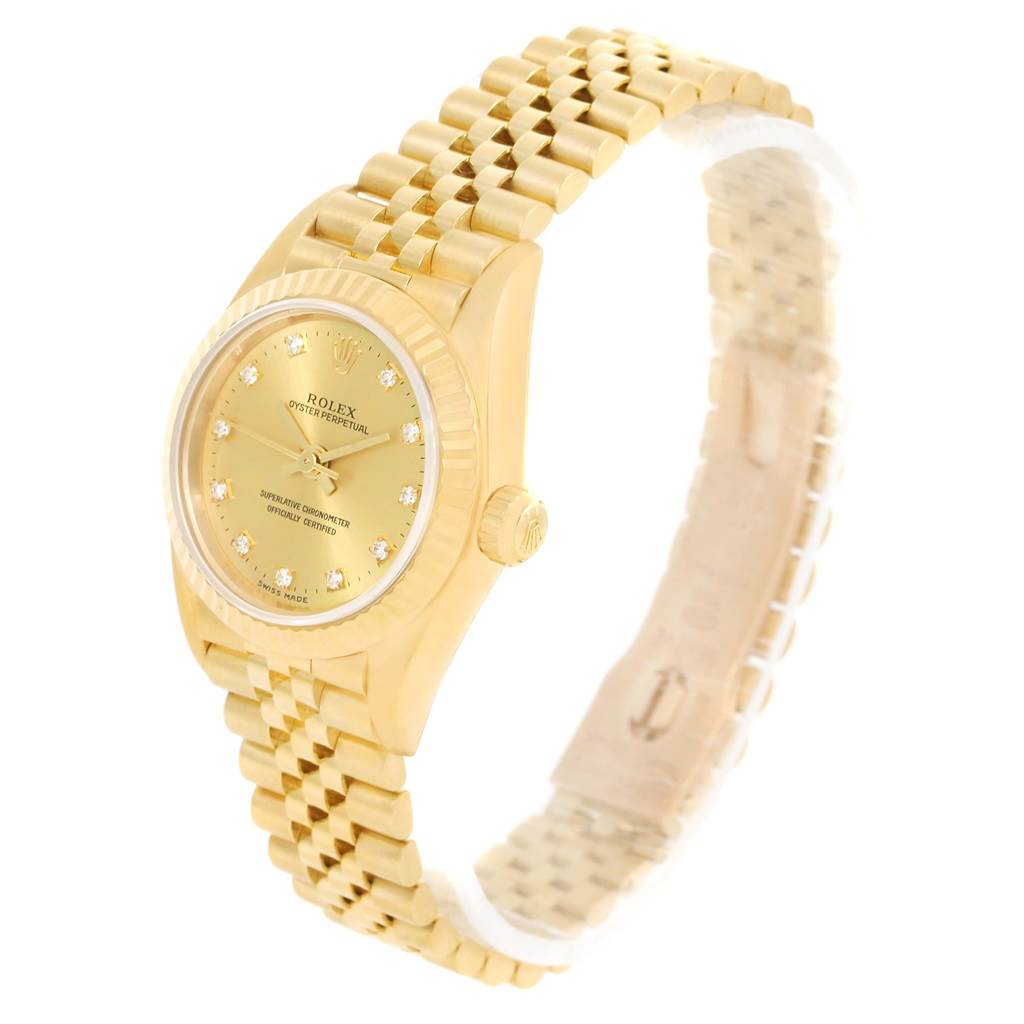 The image shows a Rolex President 76198 Women's Yellow Gold Champagne Dial 76198 Women's Yellow Gold Champagne Dial model watch at an angled view, highlighting the gold case, diamond-studded dial, and bracelet.