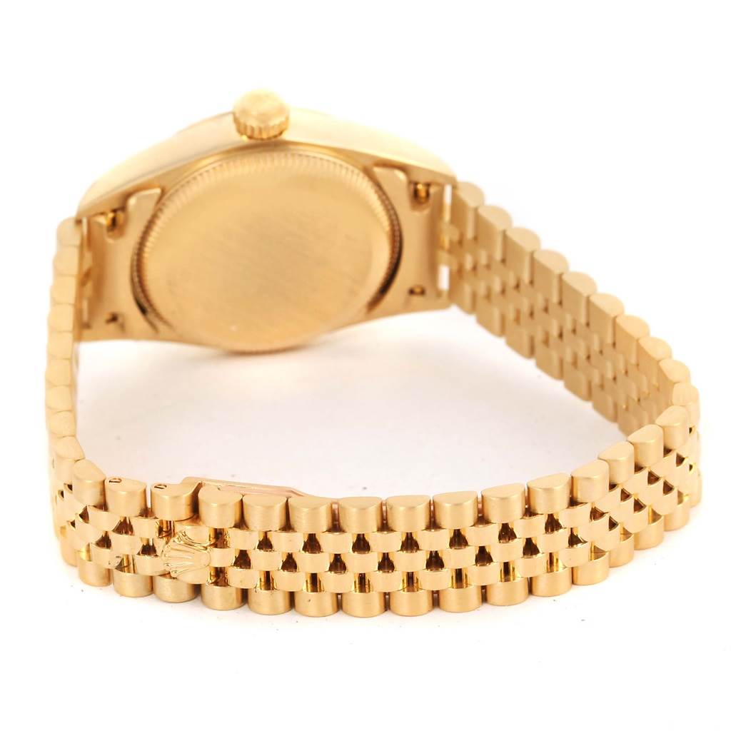 The image shows the back view of a gold Rolex President 76198 Women's Yellow Gold Champagne Dial 76198 Women's Yellow Gold Champagne Dial model watch, highlighting the case back and bracelet.