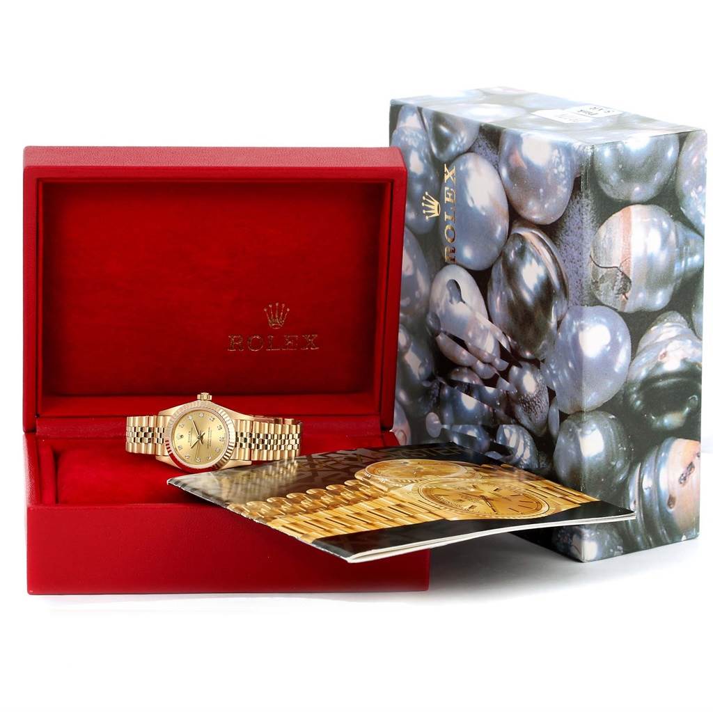 The image shows a Rolex President 76198 Women's Yellow Gold Champagne Dial 76198 Women's Yellow Gold Champagne Dial watch in a red box with outer packaging and a booklet.