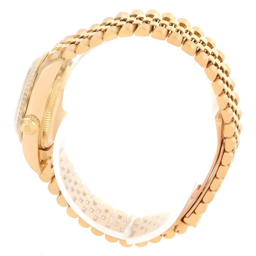 The image shows a side view of the Rolex President 76198 Women's Yellow Gold Champagne Dial 76198 Women's Yellow Gold Champagne Dial model watch, focusing on its gold case, crown, and linked bracelet.