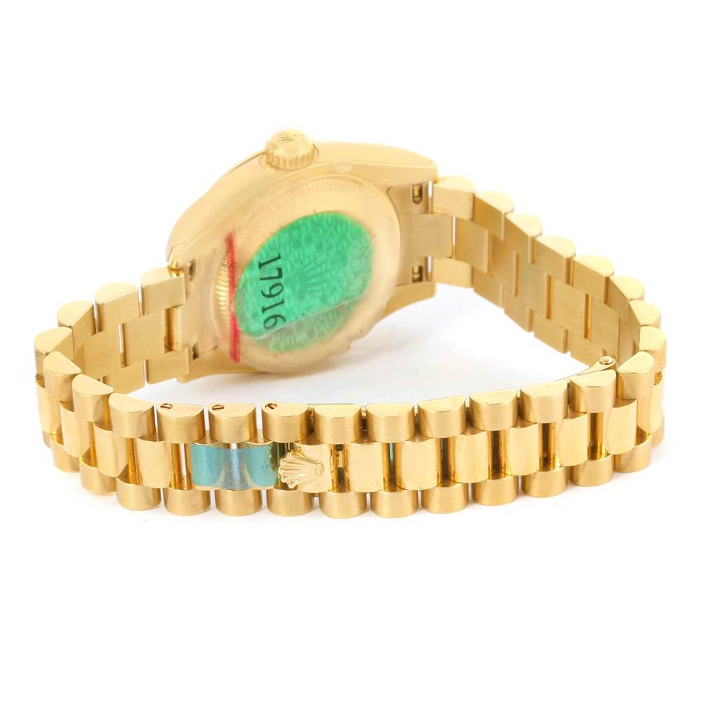 The image shows the back and band of a gold Rolex President 179168 Women's Yellow Gold White Dial 179168 Women's Yellow Gold White Dial model watch, highlighting the clasp and case back.