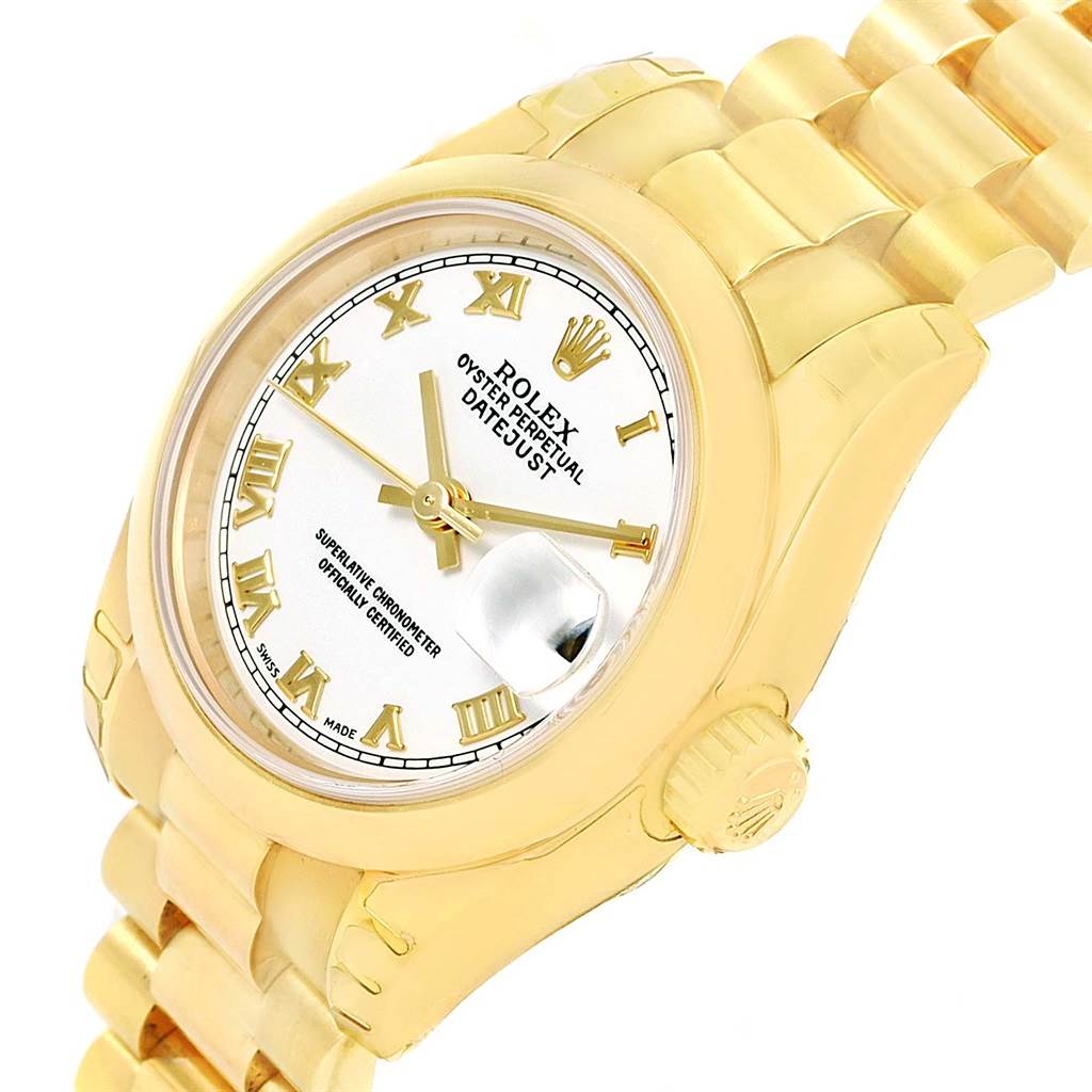 This image shows a Rolex President 179168 Women's Yellow Gold White Dial 179168 Women's Yellow Gold White Dial model watch at an angle highlighting its face, bezel, crown, and part of the bracelet.