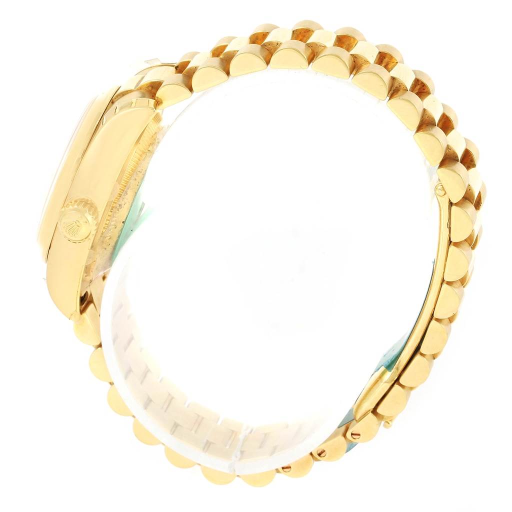 The image shows a side view of a Rolex President 179168 Women's Yellow Gold White Dial 179168 Women's Yellow Gold White Dial model, highlighting the gold bracelet and the crown side of the watch case.