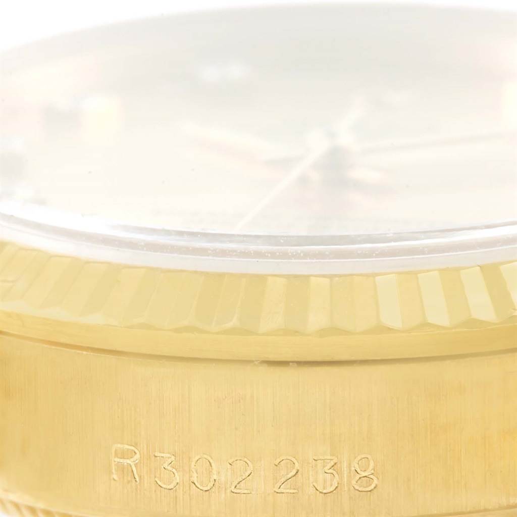 This close-up image shows the side view of the casing and bezel of a Rolex President 68278 Women's Yellow Gold Champagne Dial 68278 Women's Yellow Gold Champagne Dial model watch with a partial serial number.