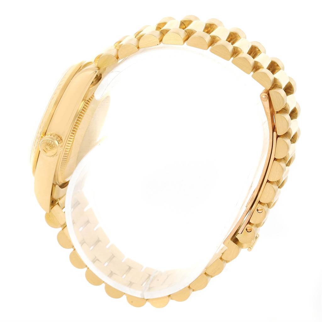 The image shows a side view of a Rolex President 68278 Women's Yellow Gold Champagne Dial 68278 Women's Yellow Gold Champagne Dial model watch, including the crown and the bracelet links.