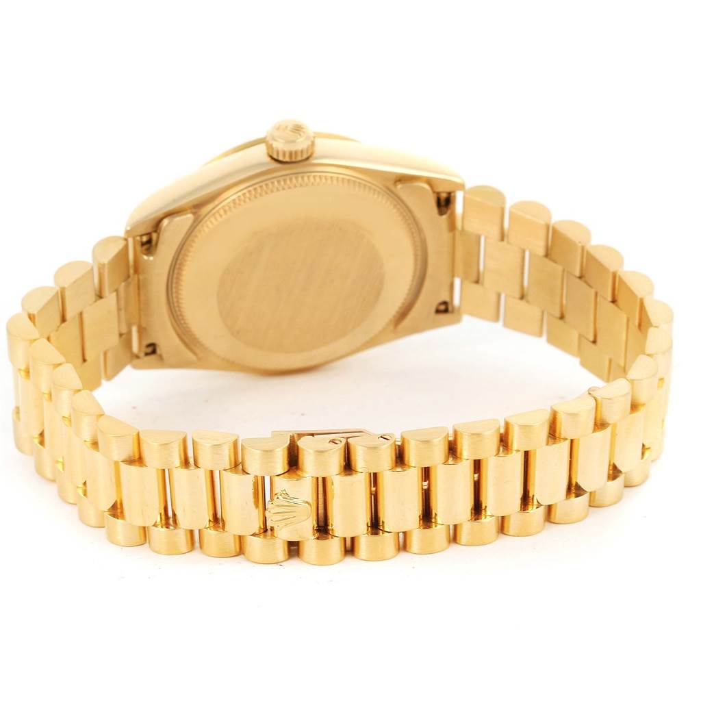 The image shows the back view of the Rolex President 68278 Women's Yellow Gold Champagne Dial 68278 Women's Yellow Gold Champagne Dial model, highlighting the case back and the President bracelet.