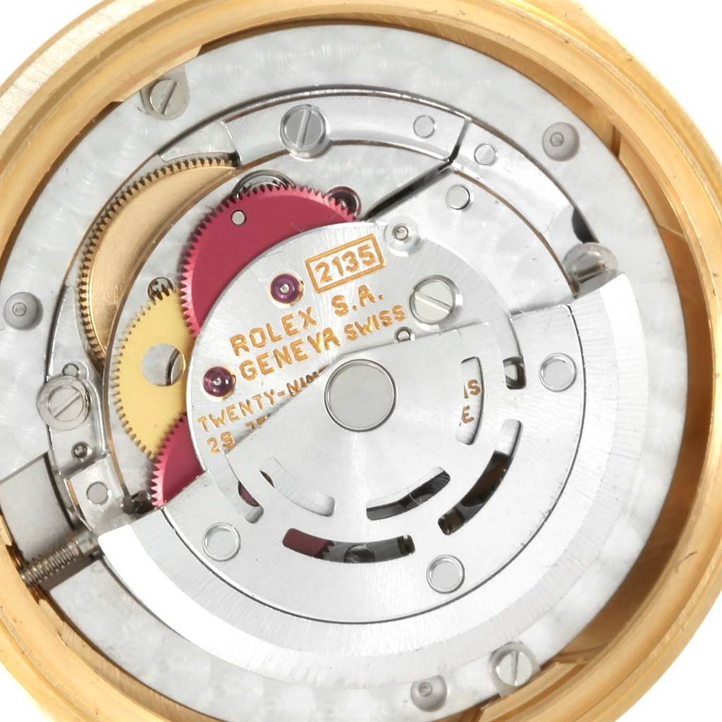 The image shows the internal mechanism of a Rolex President 68278 Women's Yellow Gold Champagne Dial 68278 Women's Yellow Gold Champagne Dial model watch, highlighting the gears, rotor, and movement parts.