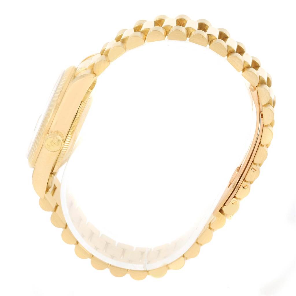 This image shows a side view of a Rolex President 68278 Women's Yellow Gold Champagne Dial 68278 Women's Yellow Gold Champagne Dial model watch, focusing on the gold case, crown, and the bracelet.