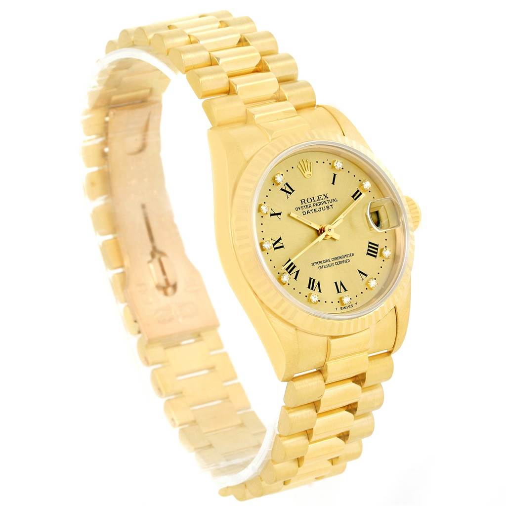 The image shows a Rolex President 68278 Women's Yellow Gold Champagne Dial 68278 Women's Yellow Gold Champagne Dial model watch at a tilted angle, highlighting the gold bracelet, dial, and date feature.