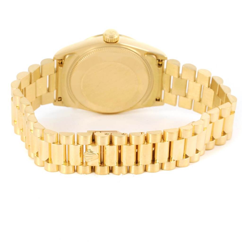 The image shows the back view of the Rolex President 68278 Women's Yellow Gold Champagne Dial 68278 Women's Yellow Gold Champagne Dial model watch, highlighting its gold bracelet and case back.
