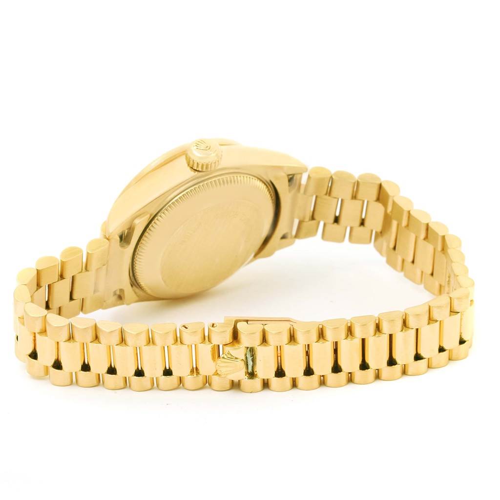 This image shows the back case and the bracelet of a Rolex President 69178 Women's Yellow Gold Blue Dial 69178 Women's Yellow Gold Blue Dial model watch at an angled view.