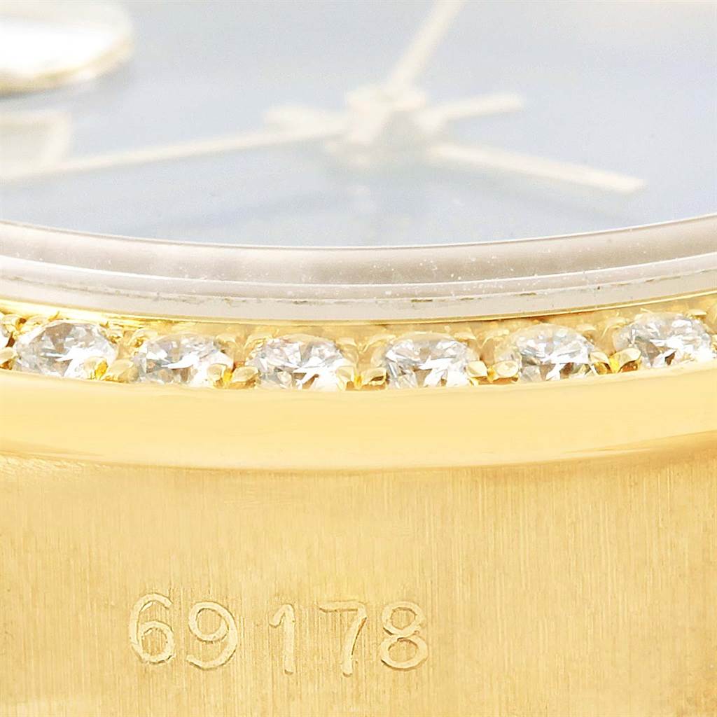 This close-up image shows the model number, diamond bezel, and part of the dial and hands of a Rolex President 69178 Women's Yellow Gold Blue Dial 69178 Women's Yellow Gold Blue Dial watch.