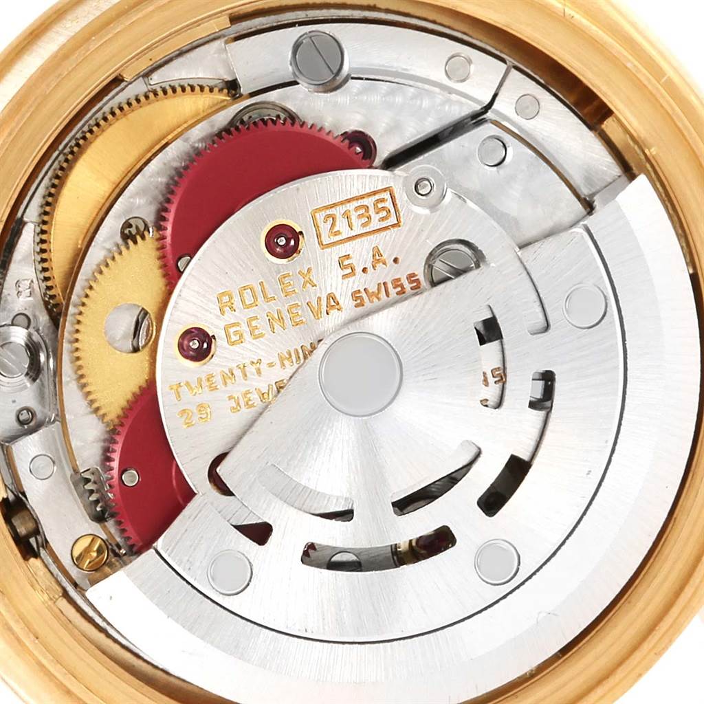 This image shows the detailed internal mechanism of a Rolex President 69178 Women's Yellow Gold Champagne Dial 69178 Women's Yellow Gold Champagne Dial model watch, specifically the movement and gears.