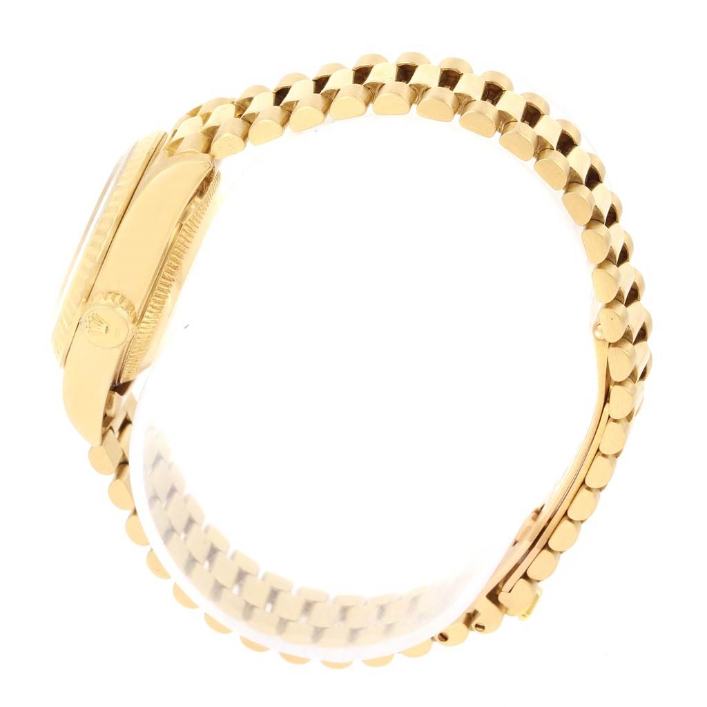 The image shows a side view of the Rolex President 69178 Women's Yellow Gold Champagne Dial 69178 Women's Yellow Gold Champagne Dial model watch, highlighting the gold case and the oyster bracelet.