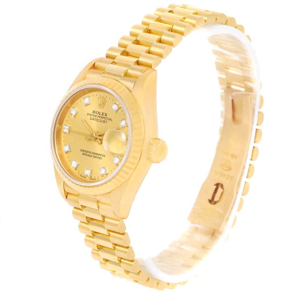 This image shows a Rolex President 69178 Women's Yellow Gold Champagne Dial 69178 Women's Yellow Gold Champagne Dial model watch, displaying the face, crown, and part of the link bracelet at an angle.