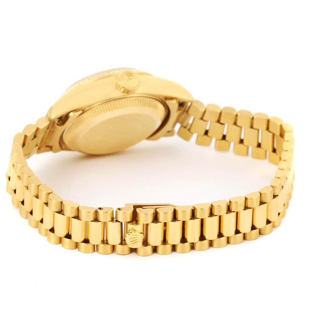 The image shows the back view of a Rolex President 69178 Women's Yellow Gold Champagne Dial 69178 Women's Yellow Gold Champagne Dial watch, focusing on its gold bracelet and case.