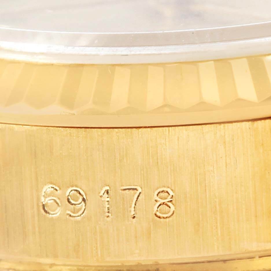 This close-up shows the side of a Rolex President 69178 Women's Yellow Gold Champagne Dial 69178 Women's Yellow Gold Champagne Dial model watch, focusing on the case and the engraved model number 69178.