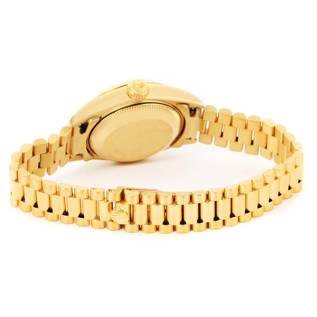The image shows the back case and the bracelet of the Rolex President 69178 Women's Yellow Gold Champagne Dial 69178 Women's Yellow Gold Champagne Dial model watch viewed at an angle.