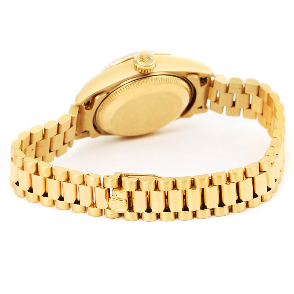 The image shows the backside and bracelet of a Rolex President 69178 Women's Yellow Gold Champagne Dial 69178 Women's Yellow Gold Champagne Dial model watch, focusing on the case and clasp.