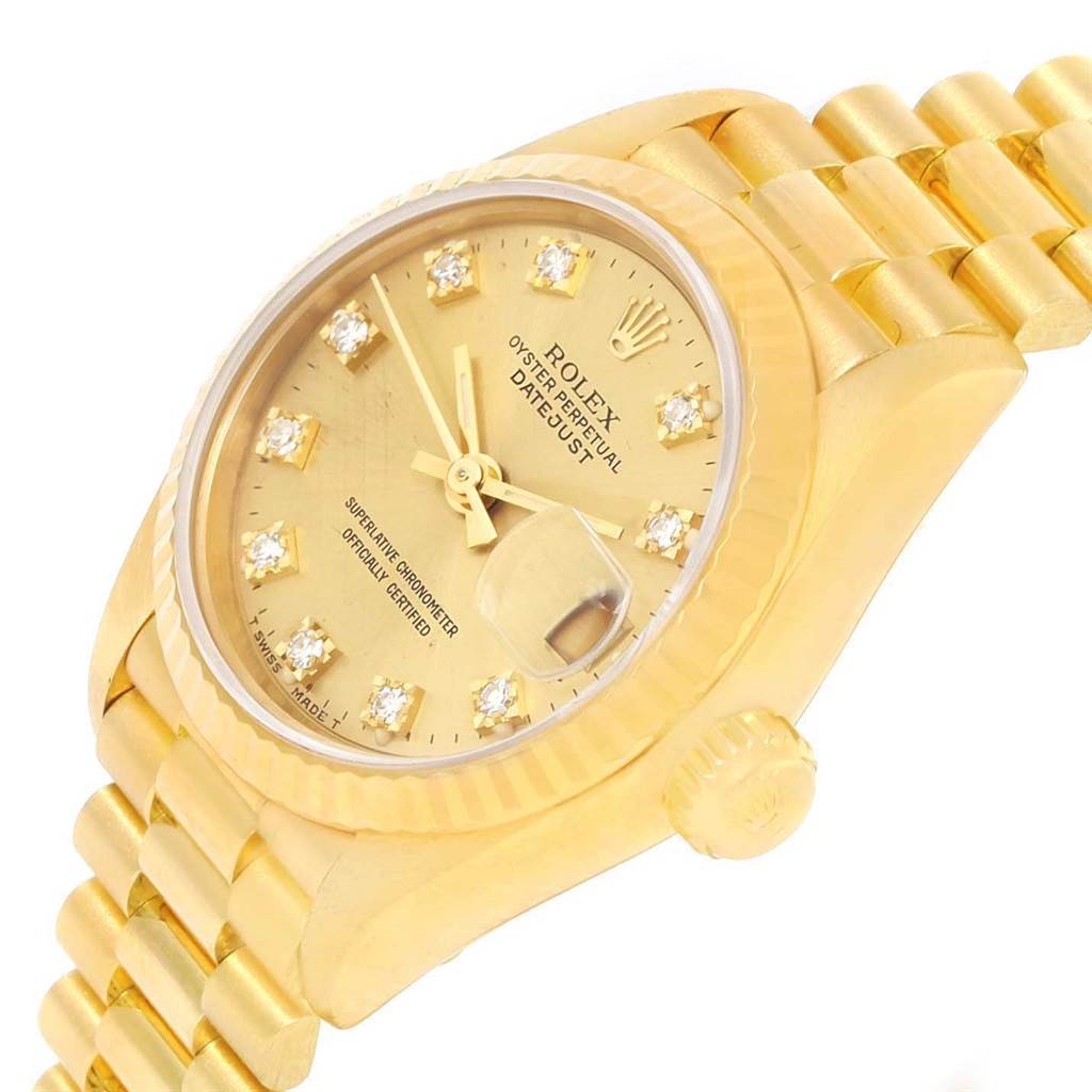 This image shows a Rolex President 69178 Women's Yellow Gold Champagne Dial 69178 Women's Yellow Gold Champagne Dial watch at an oblique angle highlighting the face, crown, and part of the bracelet.