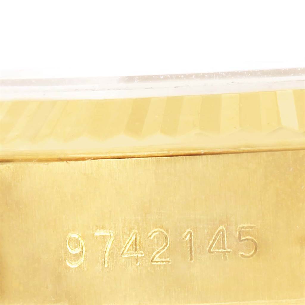 The image shows a close-up of the serial number on the side of a Rolex President 69178 Women's Yellow Gold Champagne Dial 69178 Women's Yellow Gold Champagne Dial model watch case.