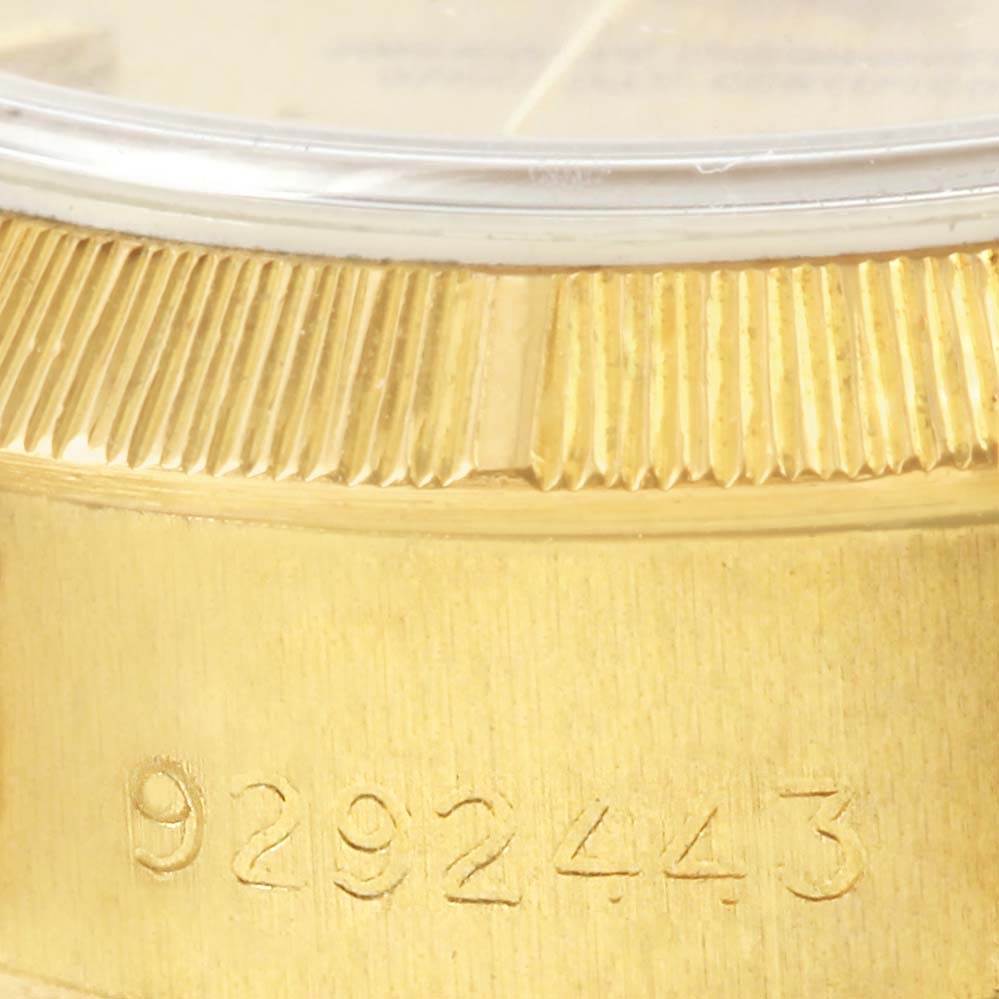 Close-up of the serial number and fluted bezel on a Rolex President 69278 Women's Yellow Gold Champagne Dial 69278 Women's Yellow Gold Champagne Dial model watch.