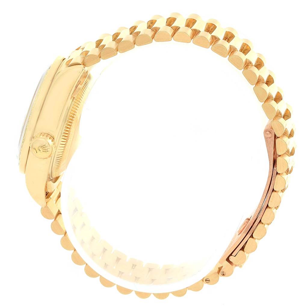 The Rolex President 69078 Women's Yellow Gold Silver Dial 69078 Women's Yellow Gold Silver Dial model watch is shown from a side angle, highlighting its gold case, crown, and bracelet.