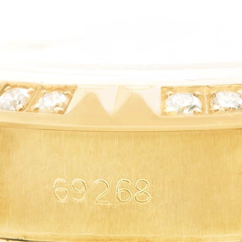 This close-up image shows part of the bezel with diamonds and the model number "69268" on the Rolex President 69158 Women's Yellow Gold Champagne Dial 69158 Women's Yellow Gold Champagne Dial watch.